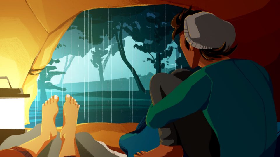 Person inside tent watching rain through opening, feet visible, cozy ambiance