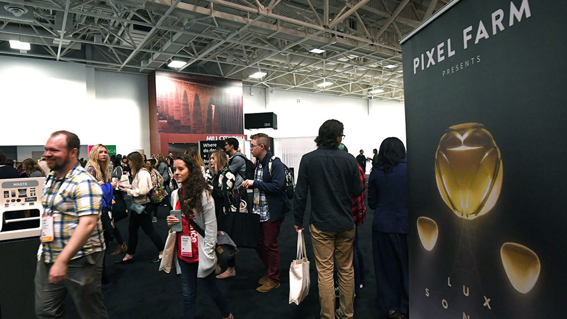Pixel Farm booth at convention with attendees viewing Lux Sonus display