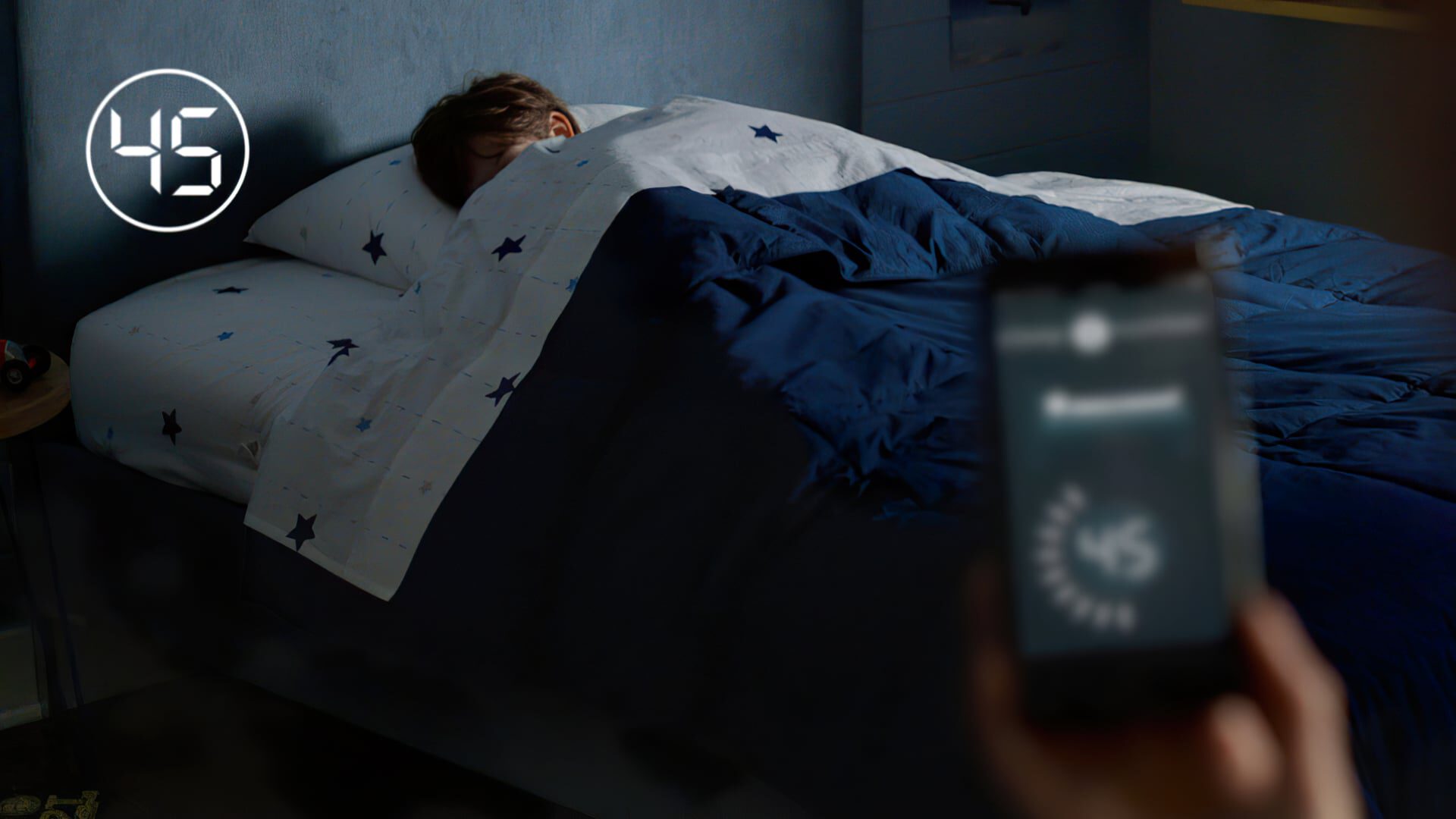 Person sleeping in bed with timer showing 45 minutes remaining.