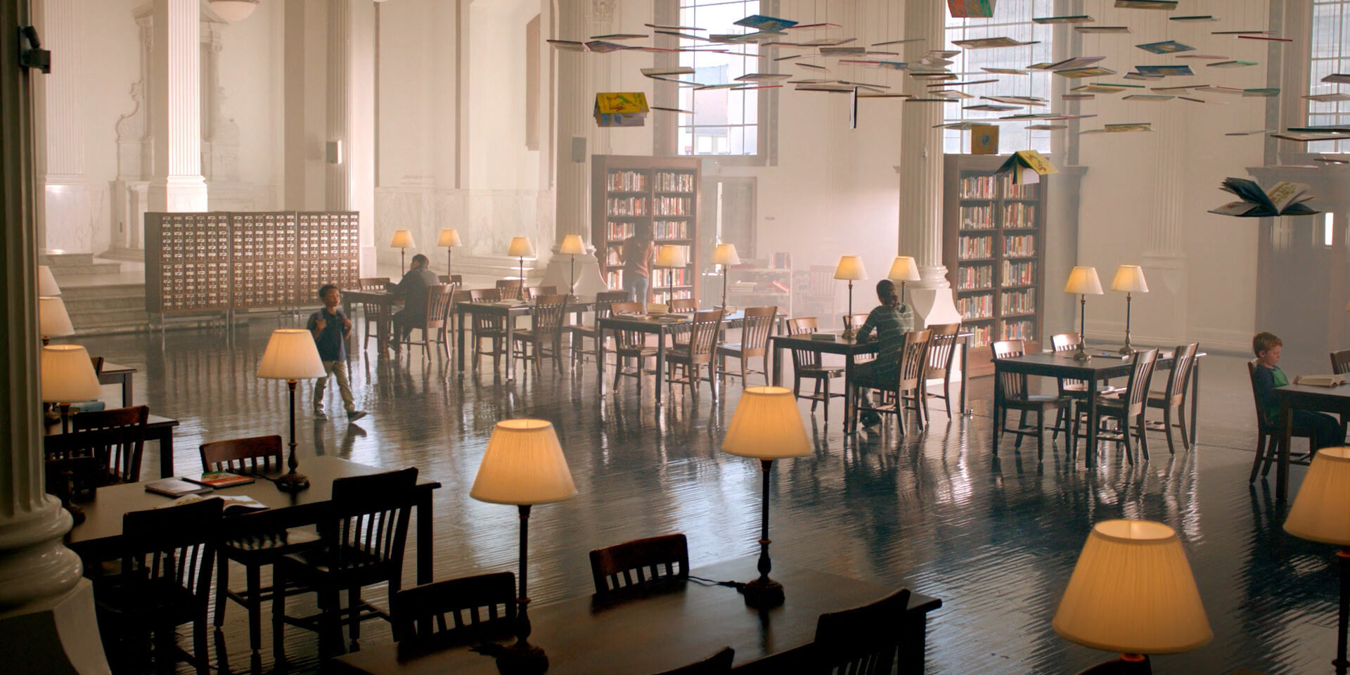 Grand library with floating books, warm lamps, and quiet readers.
