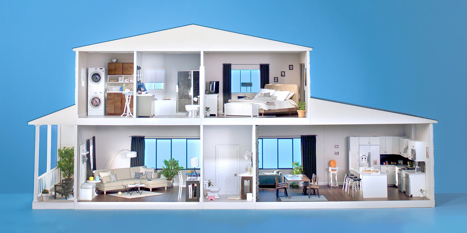 Cross-section of a modern two-story home with furnished rooms visible.