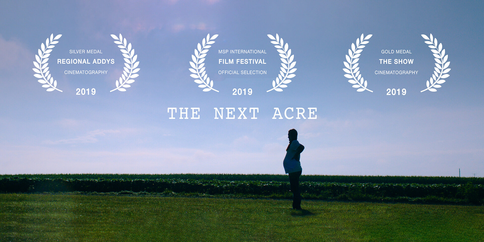 Three white laurel wreaths display awards: “Silver Medal Regional Addys Cinematography 2019,” “MSP International Film Festiva