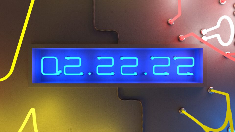 Blue neon display shows "02.22.22" against a dark background with yellow and red circuit-like lines.