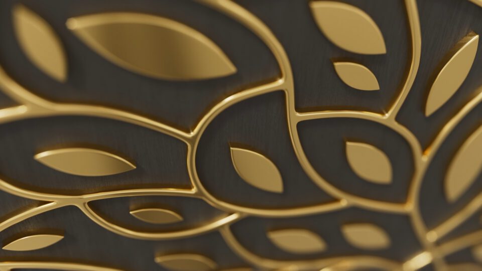 Golden leaf pattern on dark textured surface