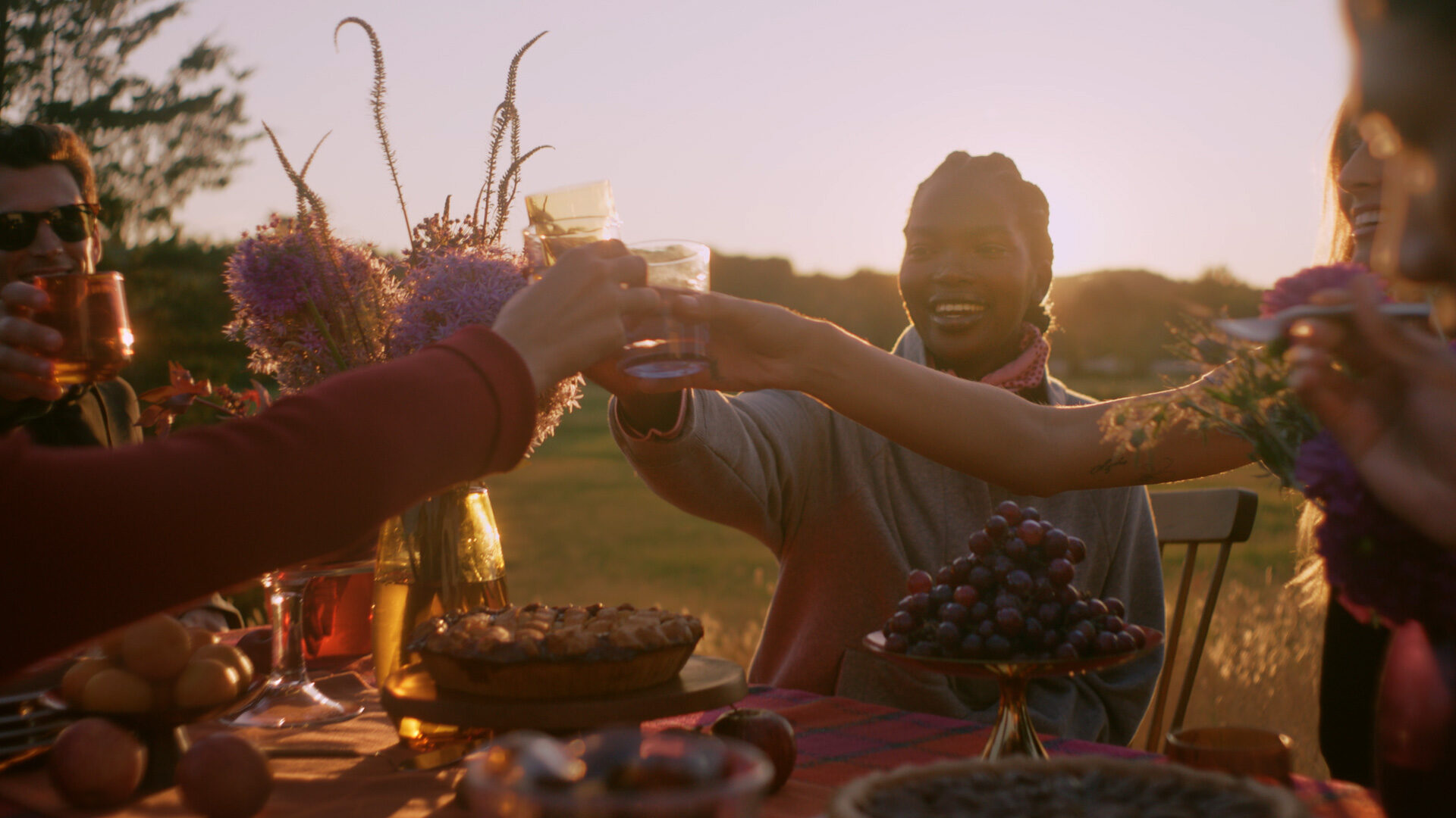 people toasting sunset