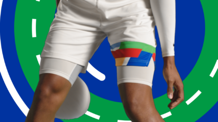 Athlete in white shorts with colorful patch, standing on stylized track background