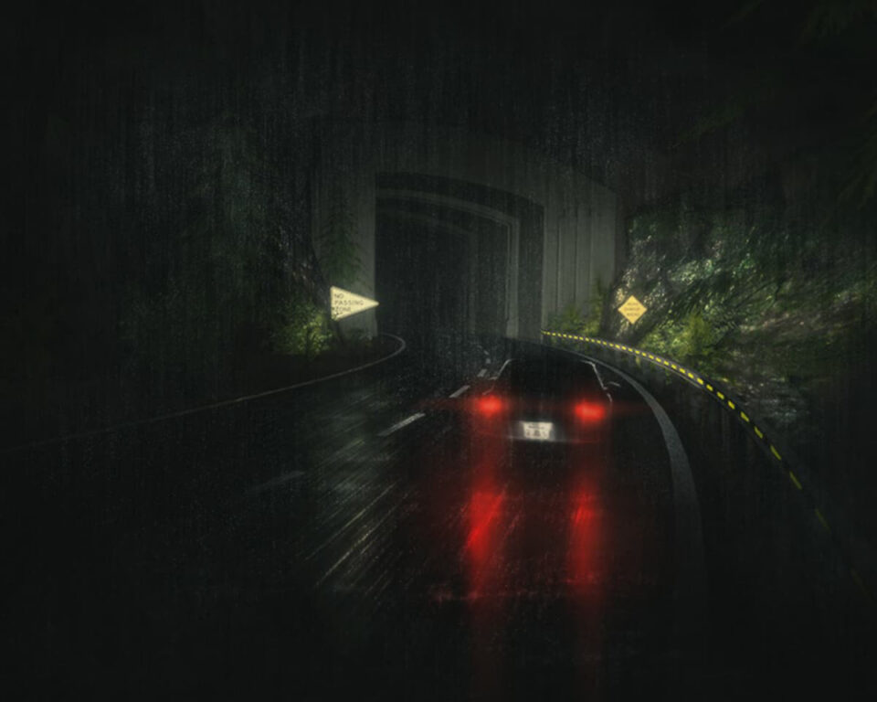 Red taillights glow on wet road as car enters dark tunnel at night.