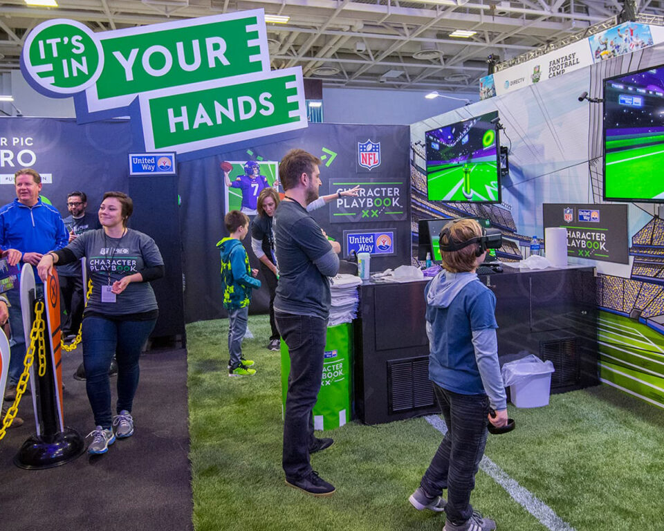 Interactive NFL character playbook exhibit with virtual reality gameplay.