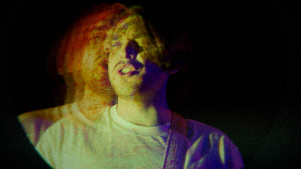 Person singing with colorful light distortion effect